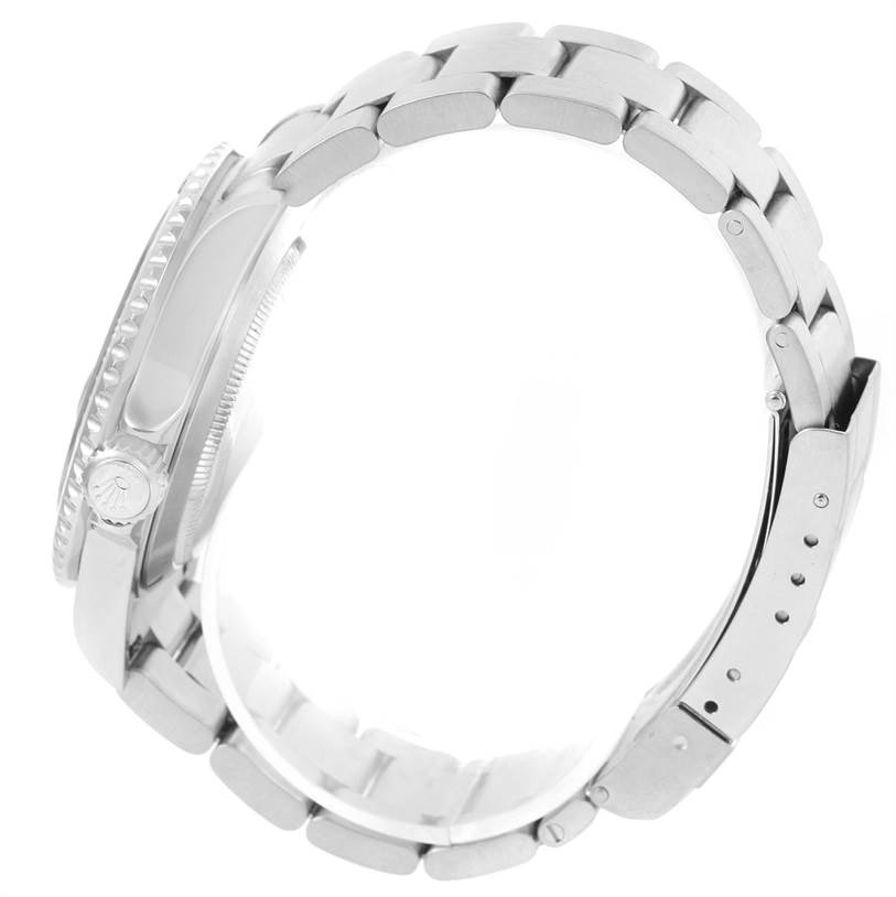 The image shows a side view of a Rolex Submariner 16610LV Men
s Stainless Steel Black Dial 16610LV Men
s Stainless Steel Black Dial watch, showcasing the bracelet, clasp, and partial case with the crown.