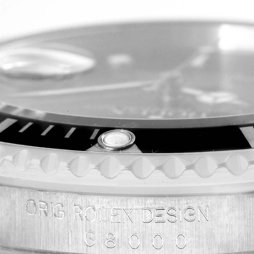 This is a close-up angled shot of the bezel and case of a Rolex Submariner 168000 Men
s Stainless Steel Black Dial 168000 Men
s Stainless Steel Black Dial watch, highlighting the model number "168000."