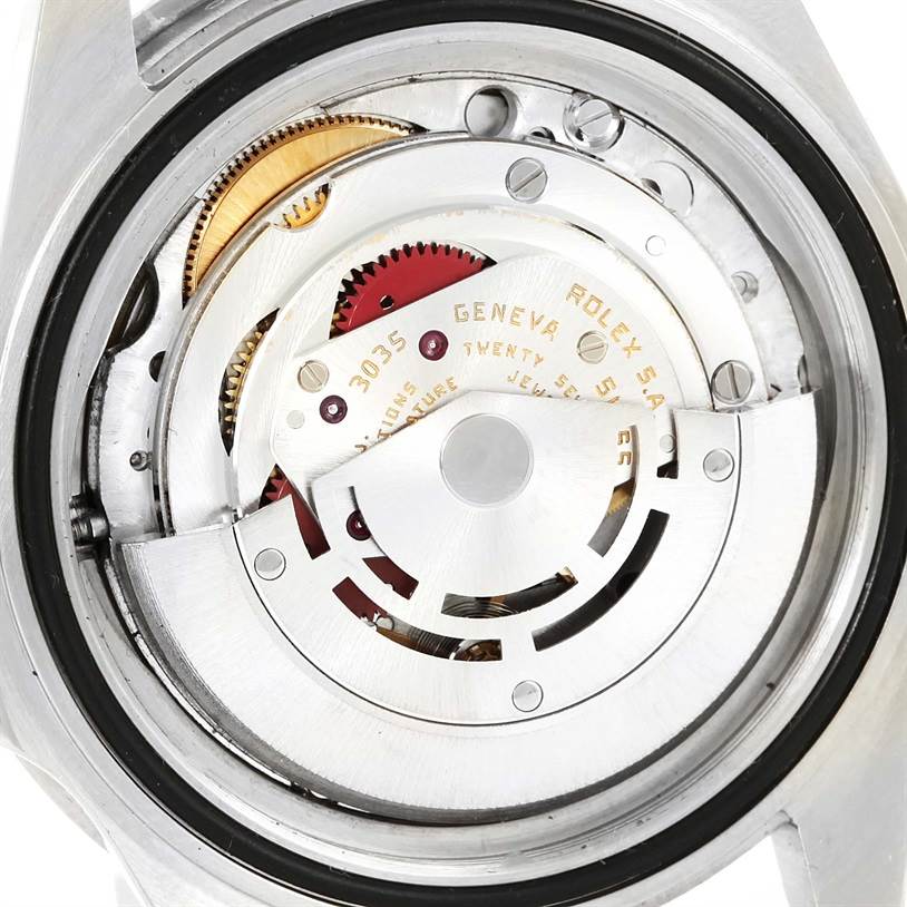 This image shows the inner mechanical movement of the Rolex Submariner 168000 Men
s Stainless Steel Black Dial 168000 Men
s Stainless Steel Black Dial watch from a back angle, focusing on the rotor and gears.