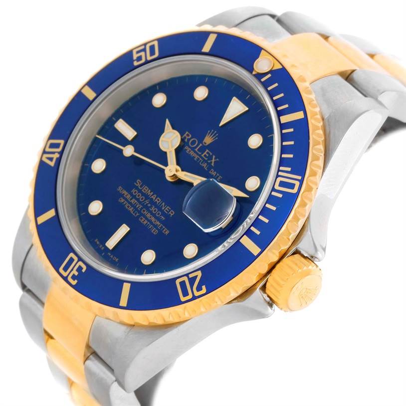 The image shows a Rolex Submariner 16613 Men
s Steel and Gold (two tone) Blue Dial 16613 Men
s Steel and Gold (two tone) Blue Dial watch featuring a blue dial, gold accents, and a side view highlighting the crown and part of the bracelet.