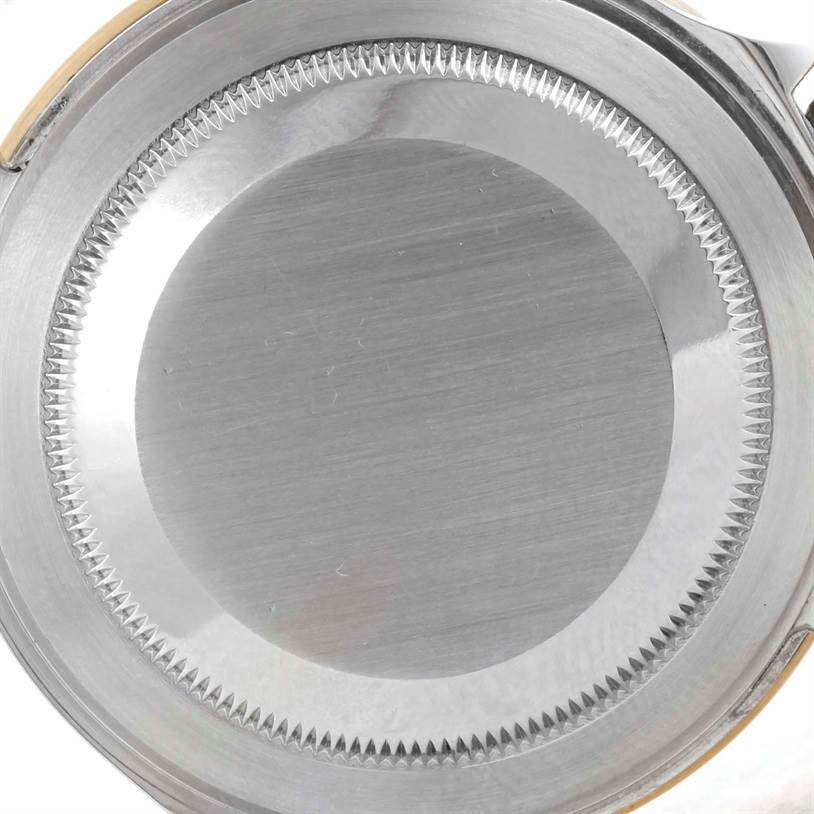 This image shows a close-up view of the back case of a Rolex Submariner 16613 Men
s Steel and Gold (two tone) Blue Dial 16613 Men
s Steel and Gold (two tone) Blue Dial watch.