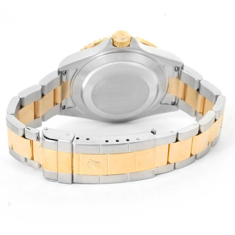 This image shows the case back and the bracelet clasp of a Rolex Submariner 16613 Men's Steel and Gold (two tone) Black Dial 16613 Men's Steel and Gold (two tone) Black Dial watch from the rear angle.