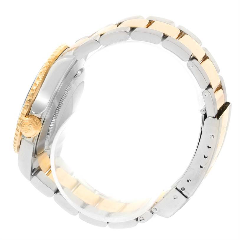 The image shows a side profile of a Rolex Submariner 16613 Men's Steel and Gold (two tone) Black Dial 16613 Men's Steel and Gold (two tone) Black Dial watch, focusing on its two-tone bracelet and crown.