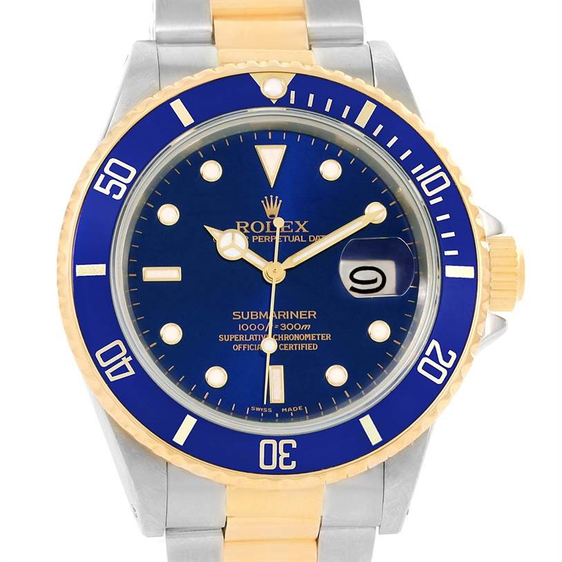 This image shows the face and part of the bracelet of a Rolex Submariner 16803 Men's Steel and Gold (two tone) Blue Dial 16803 Men's Steel and Gold (two tone) Blue Dial watch, featuring a blue dial and bezel with gold accents.