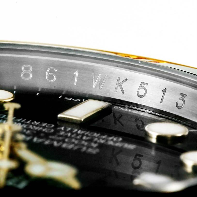 The image shows a close-up angle of the dial and rehaut of a Rolex Submariner 116613LN Men's Steel and Gold (two tone) Black Dial 116613LN Men's Steel and Gold (two tone) Black Dial watch, highlighting the serial number engraving.