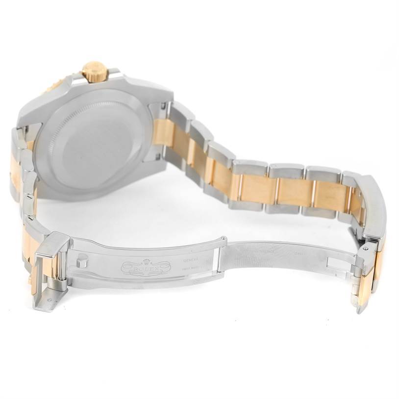 This image shows the back and partially open bracelet of a Rolex Submariner 116613LN Men's Steel and Gold (two tone) Black Dial 116613LN Men's Steel and Gold (two tone) Black Dial watch.