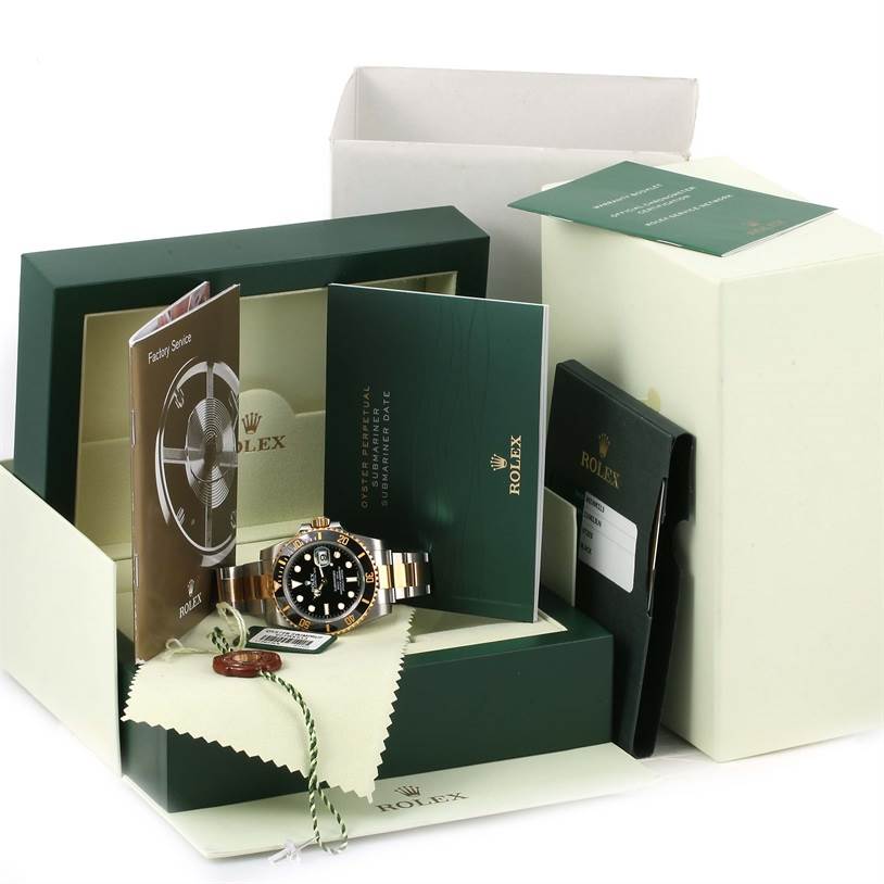 This image shows a Rolex Submariner 116613LN Men's Steel and Gold (two tone) Black Dial 116613LN Men's Steel and Gold (two tone) Black Dial watch with its original box, manual, and accessories at an angle from the top.