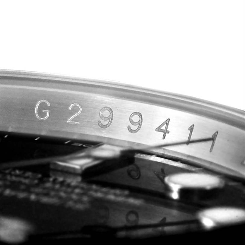 The image shows the serial number engraved on the side of a Rolex Submariner 116610 Men
s Stainless Steel Black Dial 116610 Men
s Stainless Steel Black Dial watch case.