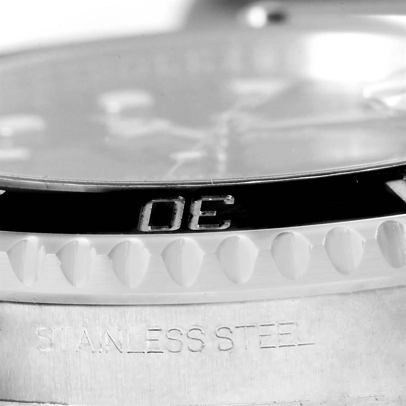 The close-up image shows the bezel and part of the case of a Rolex Submariner 116610 Men
s Stainless Steel Black Dial 116610 Men
s Stainless Steel Black Dial watch, with "STAINLESS STEEL" engraved.