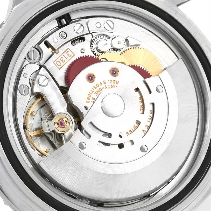 The image shows the intricate movement and internal mechanisms of a Rolex Submariner 14060 Men
s Stainless Steel Black Dial 14060 Men
s Stainless Steel Black Dial watch, viewed from a back angle.