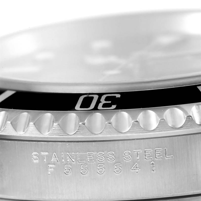 Close-up side view of the case and bezel of the Rolex Submariner 14060 Men
s Stainless Steel Black Dial 14060 Men
s Stainless Steel Black Dial, showing the "30" marking and stainless steel inscription.