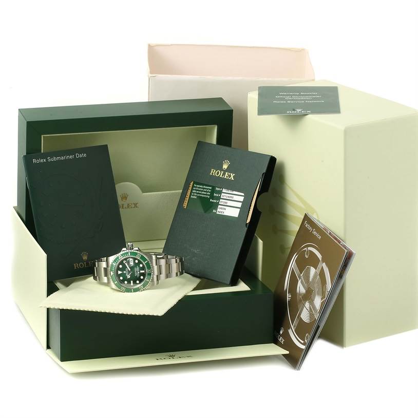 The image shows a Rolex Submariner 116610LV Men's Stainless Steel Green Dial 116610LV Men's Stainless Steel Green Dial watch with its box, warranty card, manuals, and accessories from a front angle.