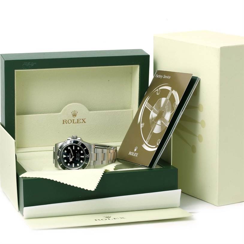 The image shows a Rolex Submariner 114060 Men
s Stainless Steel Black Dial 114060 Men
s Stainless Steel Black Dial watch in its box with the warranty card and instruction book.