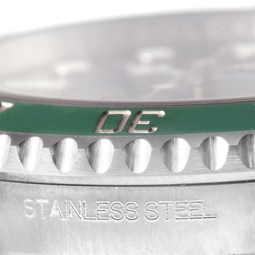 Close-up view of the bezel and case edge of the Rolex Submariner 116610LV Men's Stainless Steel Green Dial 116610LV Men's Stainless Steel Green Dial watch, showing the green bezel and "STAINLESS STEEL" engraving.