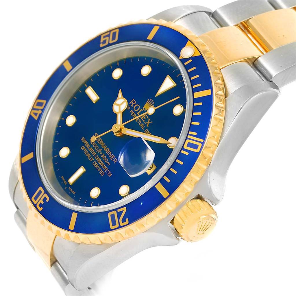 The image shows a Rolex Submariner 16613 Men
s Steel and Gold (two tone) Blue Dial 16613 Men
s Steel and Gold (two tone) Blue Dial watch in a three-quarter angle, highlighting the blue dial, bezel, crown, and part of the bracelet.