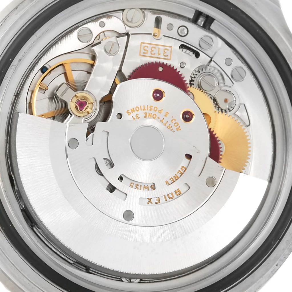 This image shows a close-up view of the movement of a Rolex Submariner 16610 Men
s Stainless Steel Black Dial 16610 Men
s Stainless Steel Black Dial watch, highlighting its intricate internal mechanisms.