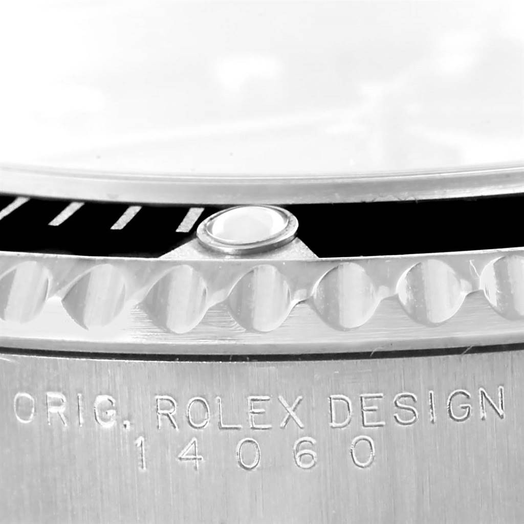 This image shows a close-up of the bezel and engraved case of a Rolex Submariner 14060 Men
s Stainless Steel Black Dial 14060 Men
s Stainless Steel Black Dial, highlighting the "ORIG. ROLEX DESIGN 14060" inscription.