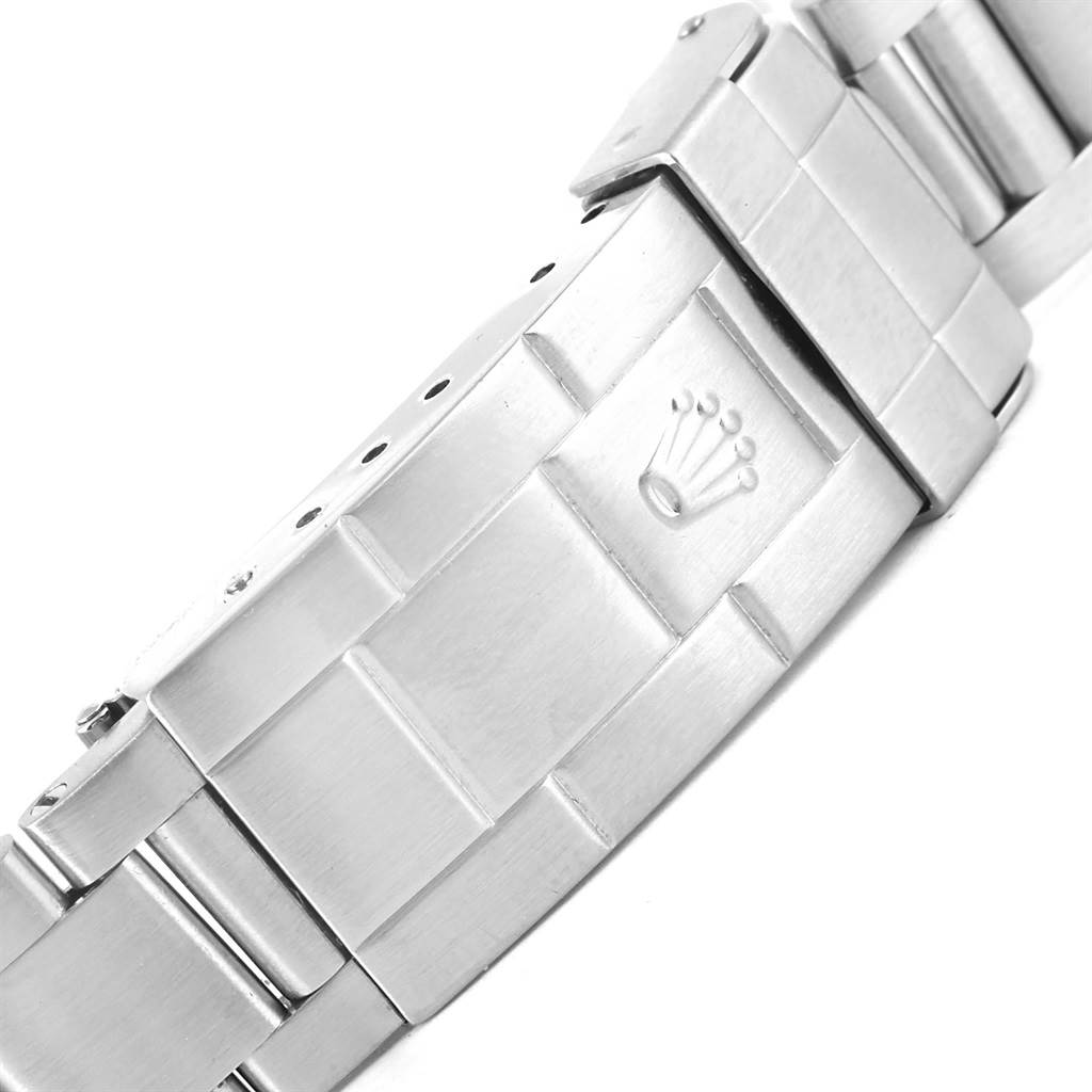 The image shows a close-up of the clasp on the bracelet of a Rolex Submariner 14060 Men
s Stainless Steel Black Dial 14060 Men
s Stainless Steel Black Dial watch, featuring the Rolex crown logo.