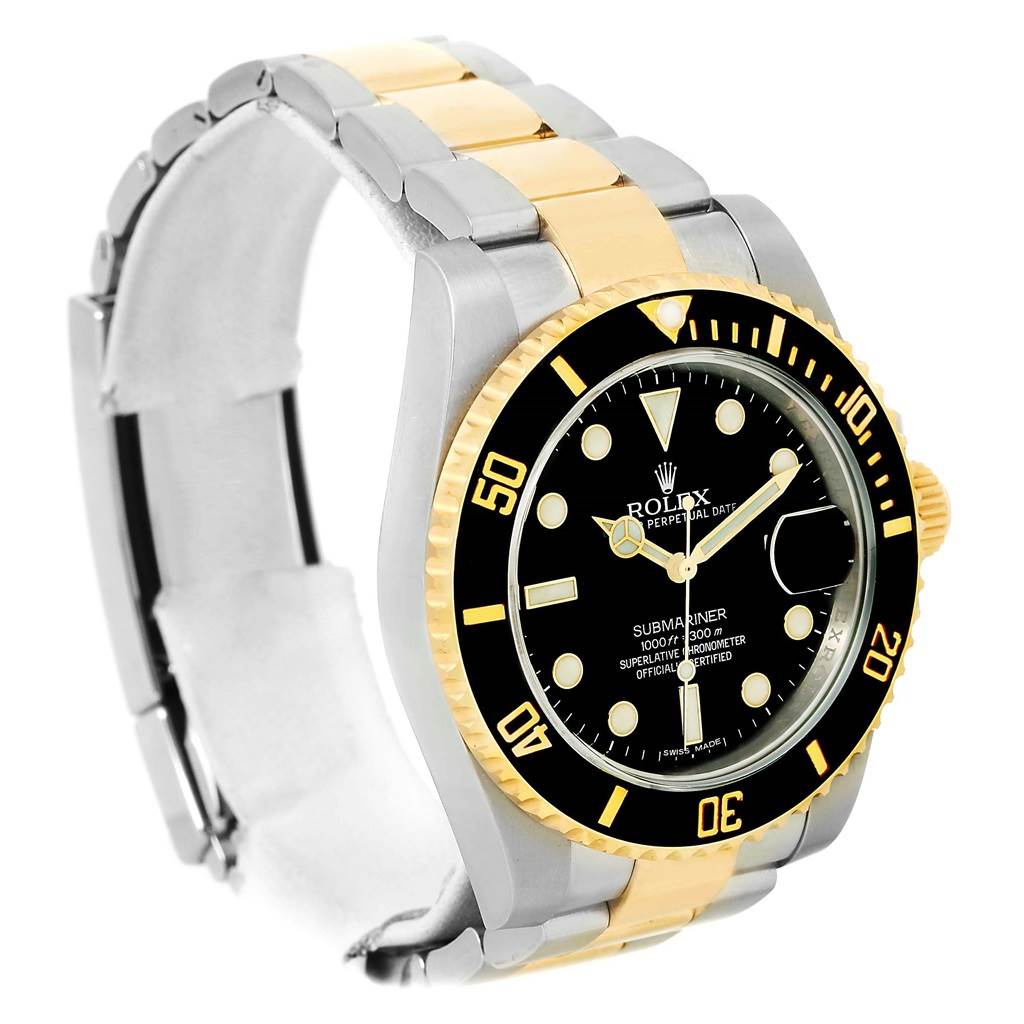 The image shows a Rolex Submariner 116613 Men
s Steel and Gold (two tone) Black Dial 116613 Men
s Steel and Gold (two tone) Black Dial watch at a slight angle, highlighting its black dial, gold and silver bracelet, and rotating bezel.