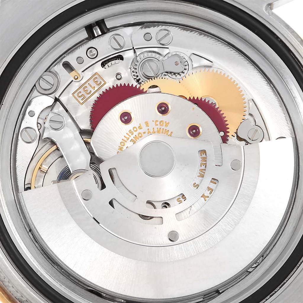 This close-up image shows the inner mechanism and movement components of the Rolex Submariner 116613 Men
s Steel and Gold (two tone) Black Dial 116613 Men
s Steel and Gold (two tone) Black Dial watch.