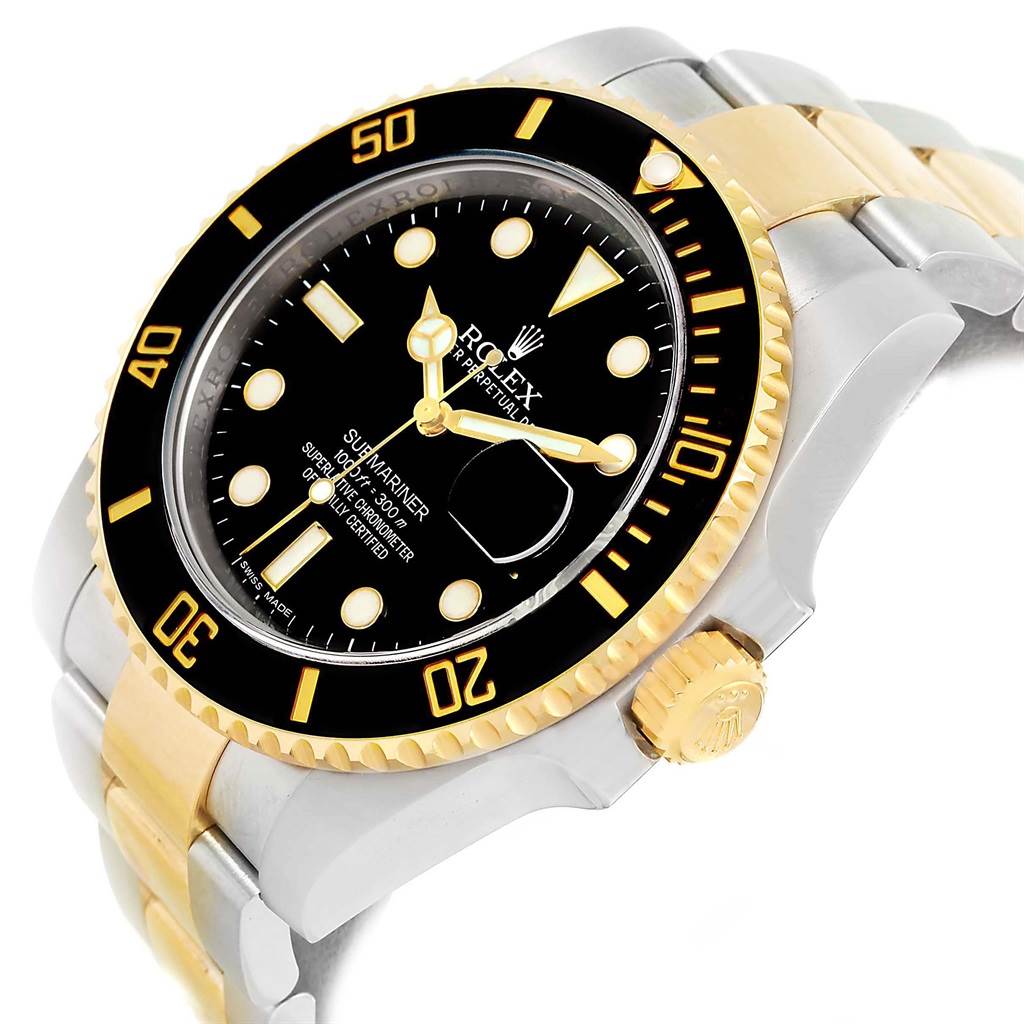 This image shows a Rolex Submariner 116613 Men
s Steel and Gold (two tone) Black Dial 116613 Men
s Steel and Gold (two tone) Black Dial watch with a gold and silver bracelet, black bezel, and dial at a slight angle.