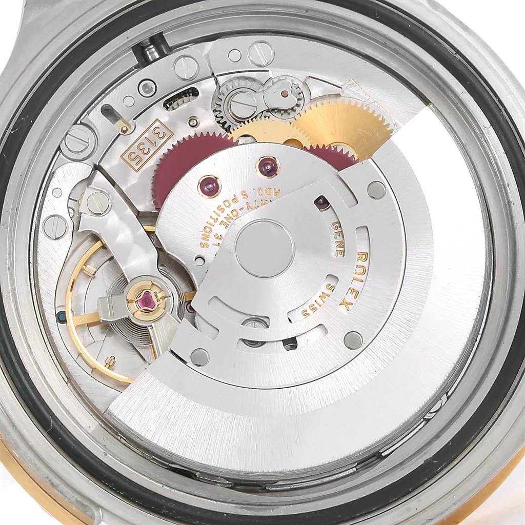 This image shows the internal movement mechanism of a Rolex Submariner 16613 Men
s Steel and Gold (two tone) Blue Dial 16613 Men
s Steel and Gold (two tone) Blue Dial watch from a back angle.