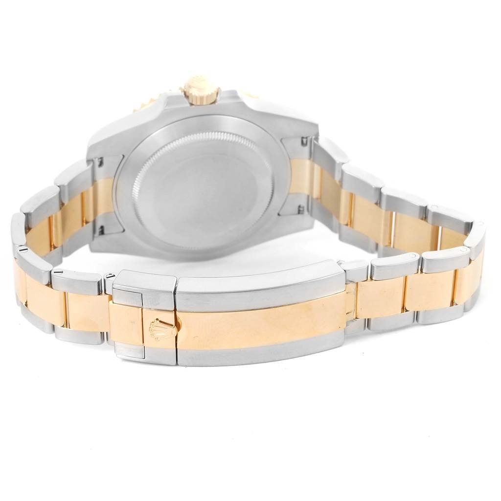 The image shows the back of the case and the bracelet of a Rolex Submariner 116613 Men
s Steel and Gold (two tone) Blue Dial 116613 Men
s Steel and Gold (two tone) Blue Dial watch, highlighting its clasp and links.