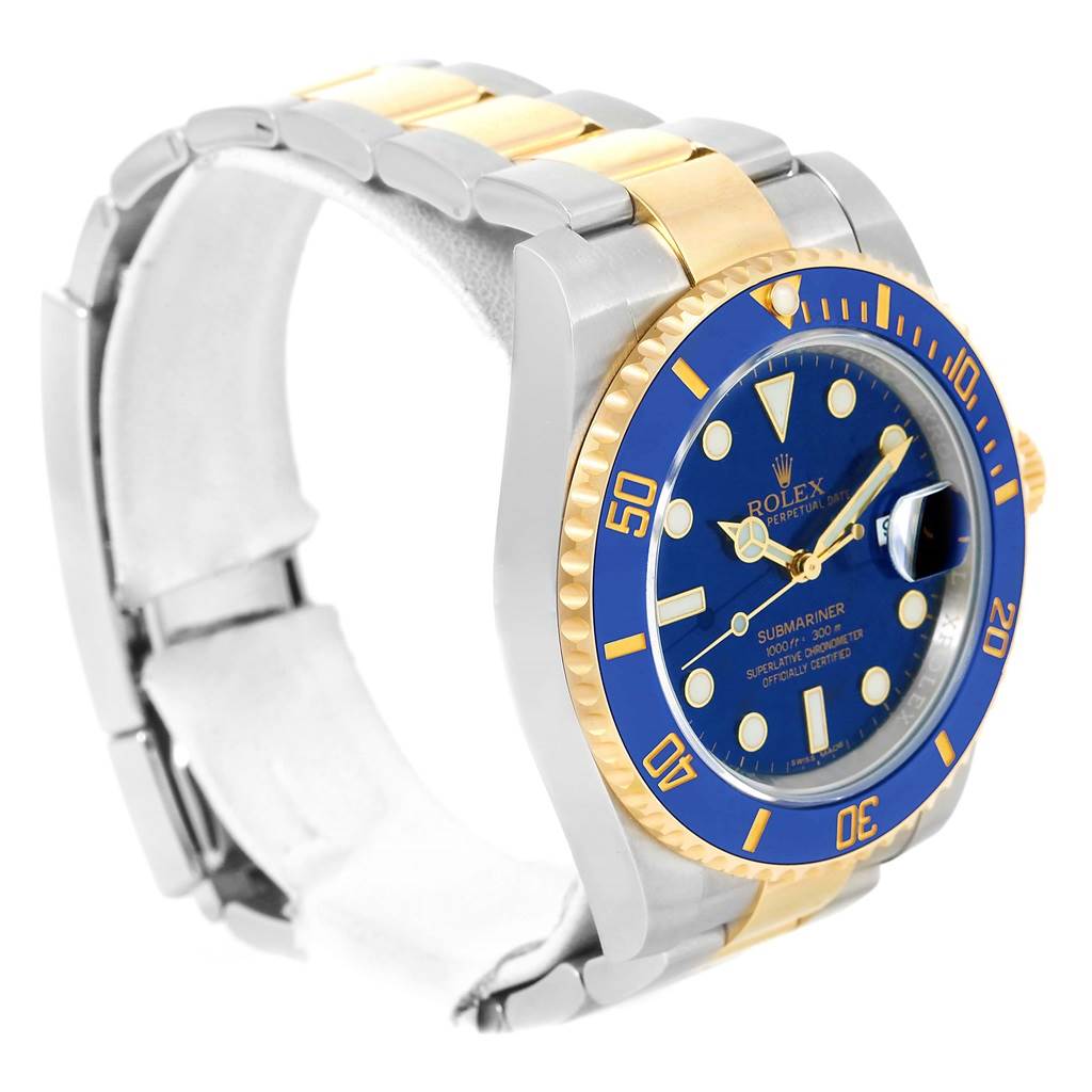This image shows a Rolex Submariner 116613 Men
s Steel and Gold (two tone) Blue Dial 116613 Men
s Steel and Gold (two tone) Blue Dial watch at an angle highlighting the blue dial, blue and gold bezel, and two-tone metal bracelet.