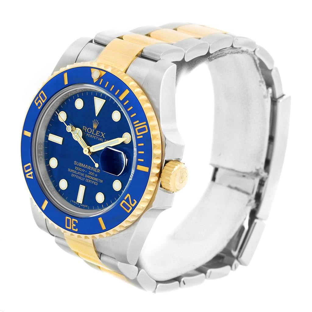 The image shows a Rolex Submariner 116613 Men
s Steel and Gold (two tone) Blue Dial 116613 Men
s Steel and Gold (two tone) Blue Dial watch at a three-quarter angle, highlighting its blue dial, gold accents, and two-tone bracelet.
