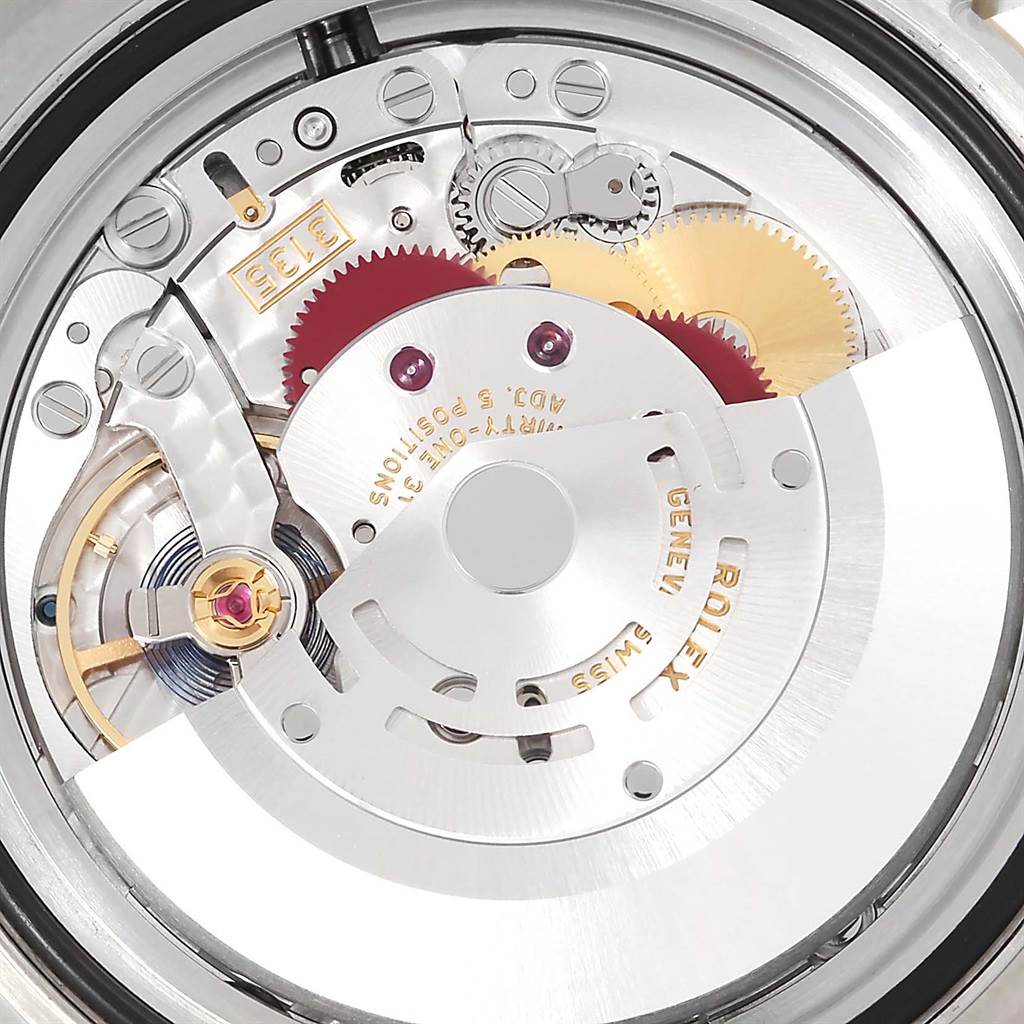 The image shows the internal mechanical movement of a Rolex Submariner 116613 Men
s Steel and Gold (two tone) Blue Dial 116613 Men
s Steel and Gold (two tone) Blue Dial watch from a close-up angle.