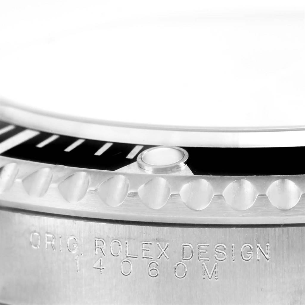 This close-up angle shows the bezel, crystal, and engraved model number on a Rolex Submariner 14060 Men
s Stainless Steel Black Dial 14060 Men
s Stainless Steel Black Dial watch.