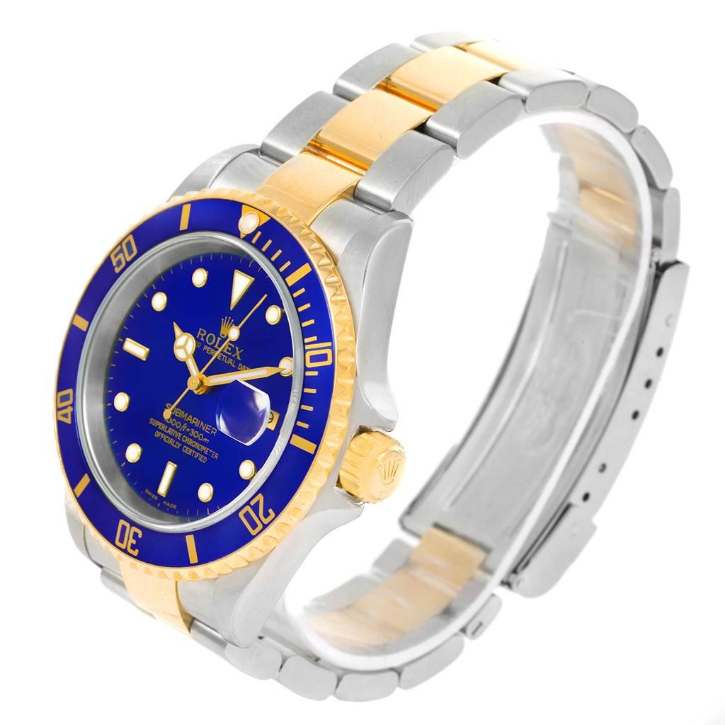 The image shows a side angle of a Rolex Submariner 16613 Men
s Steel and Gold (two tone) Blue Dial 16613 Men
s Steel and Gold (two tone) Blue Dial watch, highlighting the bezel, dial, crown, and two-tone bracelet.