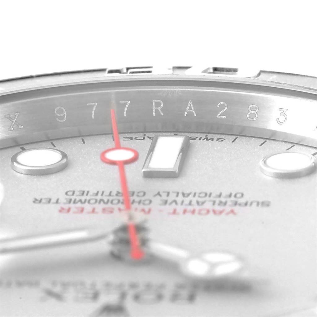 This close-up image of a Rolex Submariner 116622 Men
s Stainless Steel Silver Dial 116622 Men
s Stainless Steel Silver Dial watch shows the serial number etched on the inner bezel, part of the dial, and the second hand.