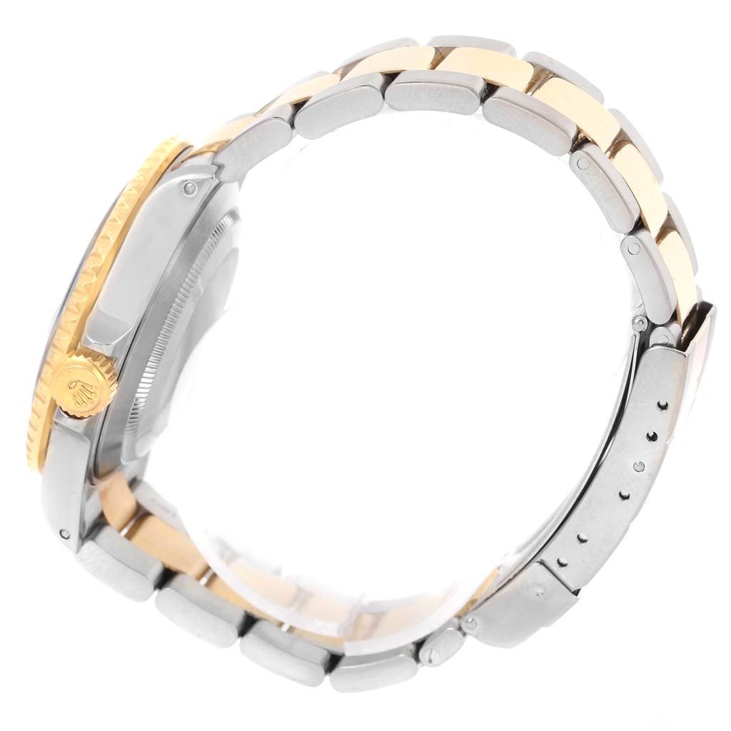 This side view of the Rolex Submariner 16613 Men's Steel and Gold (two tone) Blue Dial 16613 Men's Steel and Gold (two tone) Blue Dial shows the bracelet and crown.