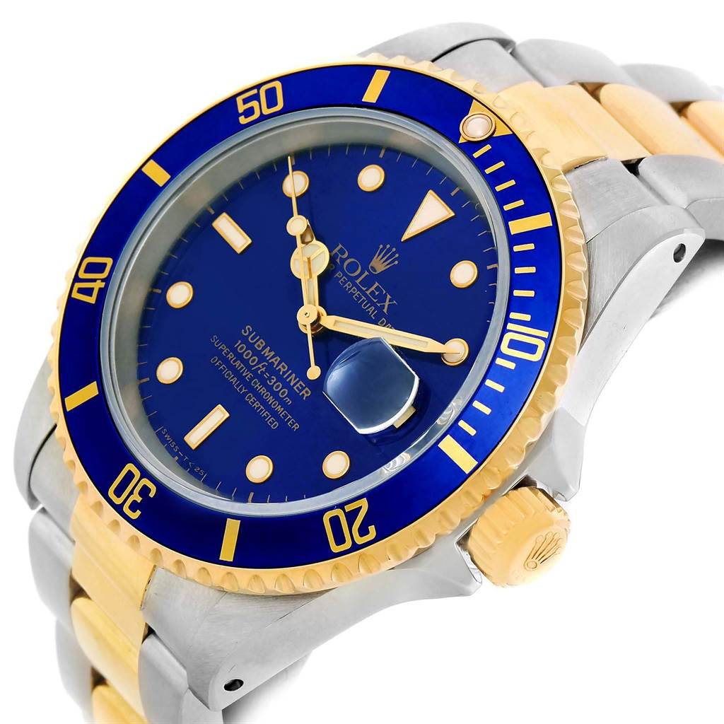 The image shows a close-up angle of a Rolex Submariner 16613 Men's Steel and Gold (two tone) Blue Dial 16613 Men's Steel and Gold (two tone) Blue Dial model, highlighting the dial, bezel, crown, and part of the bracelet.