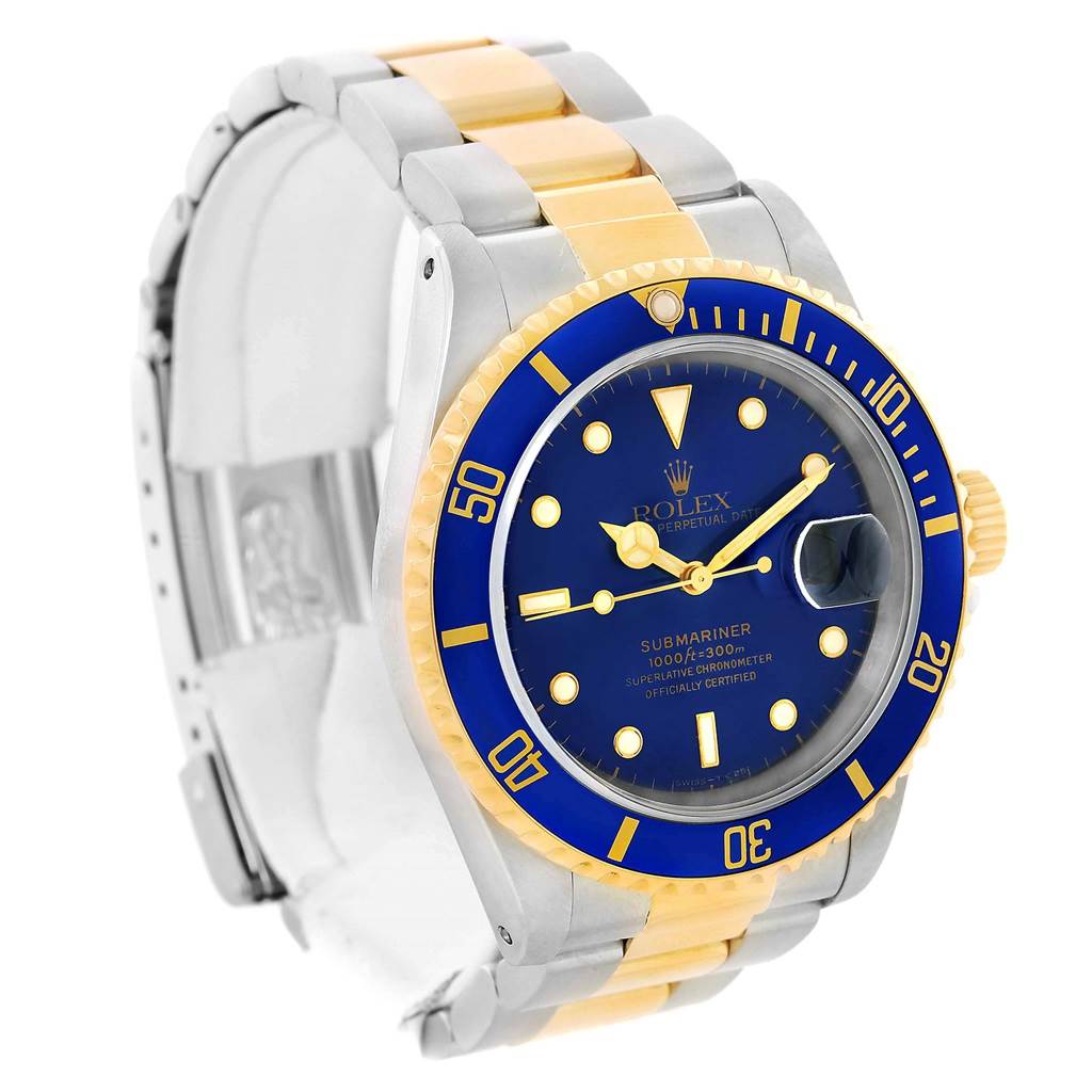 The Rolex Submariner 16613 Men's Steel and Gold (two tone) Blue Dial 16613 Men's Steel and Gold (two tone) Blue Dial watch is shown at an angled view, highlighting its blue dial, two-tone bracelet, and blue bezel.