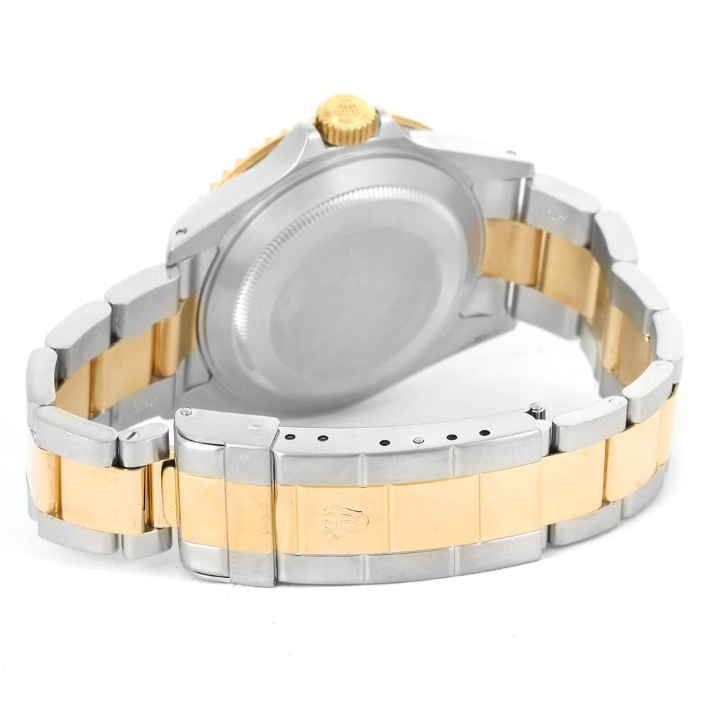 The image shows the back case and bracelet of a Rolex Submariner 16613 Men's Steel and Gold (two tone) Blue Dial 16613 Men's Steel and Gold (two tone) Blue Dial watch from a rear angle.