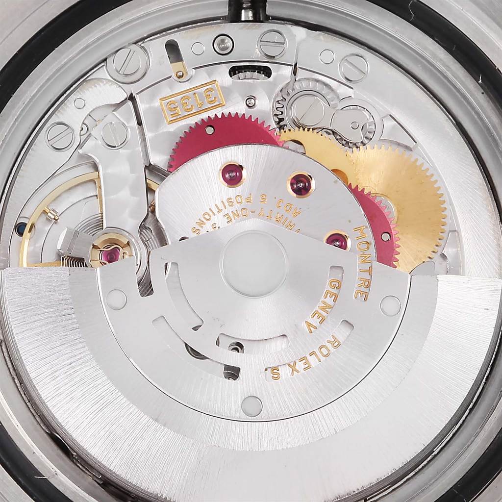 The image shows the movement and internal mechanical parts of a Rolex Submariner 16613 Men's Steel and Gold (two tone) Blue Dial 16613 Men's Steel and Gold (two tone) Blue Dial watch from a top-down angle.