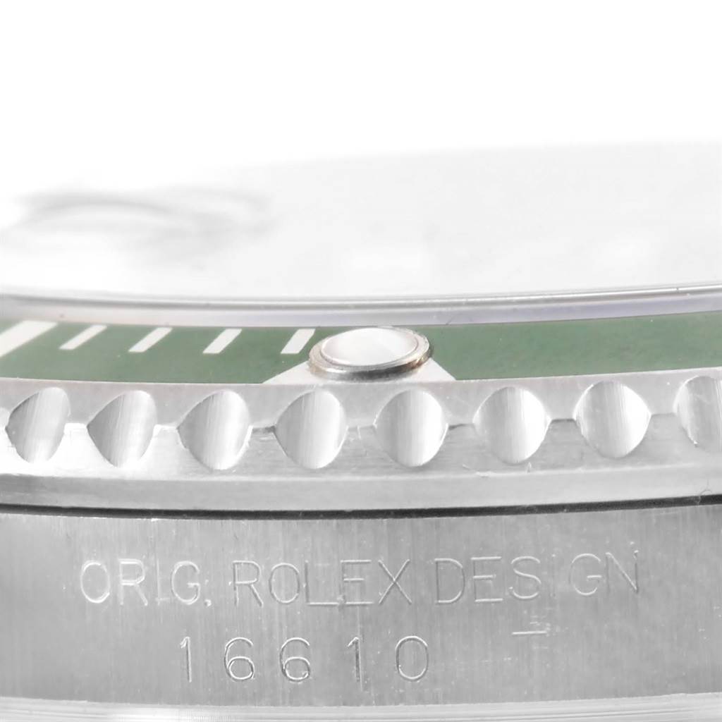 The image shows a close-up of the bezel and casing with model engraving on the Rolex Submariner 16610LV Men
s Stainless Steel Black Dial 16610LV Men
s Stainless Steel Black Dial watch.