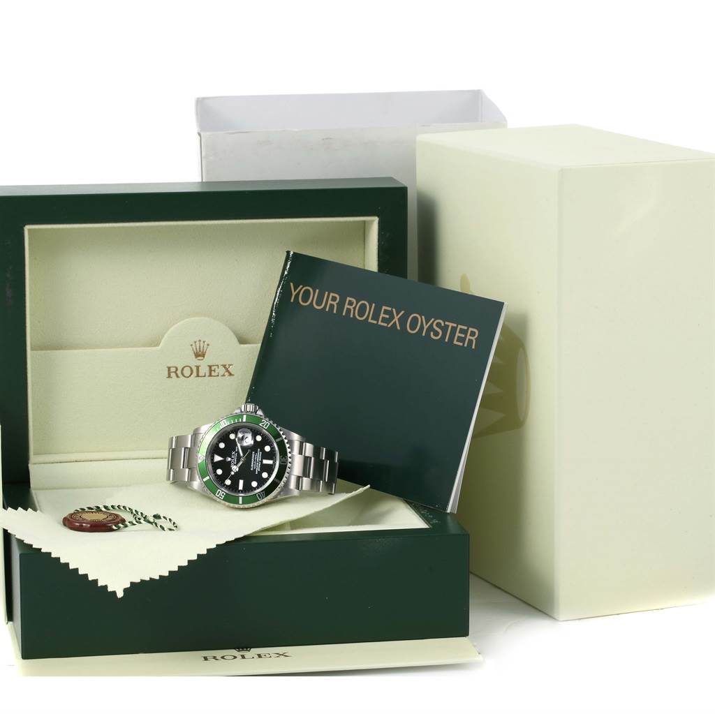 The image shows a Rolex Submariner 16610LV Men
s Stainless Steel Black Dial 16610LV Men
s Stainless Steel Black Dial watch inside its box, with the booklet "Your Rolex Oyster" and an Best Quality
ity tag.
