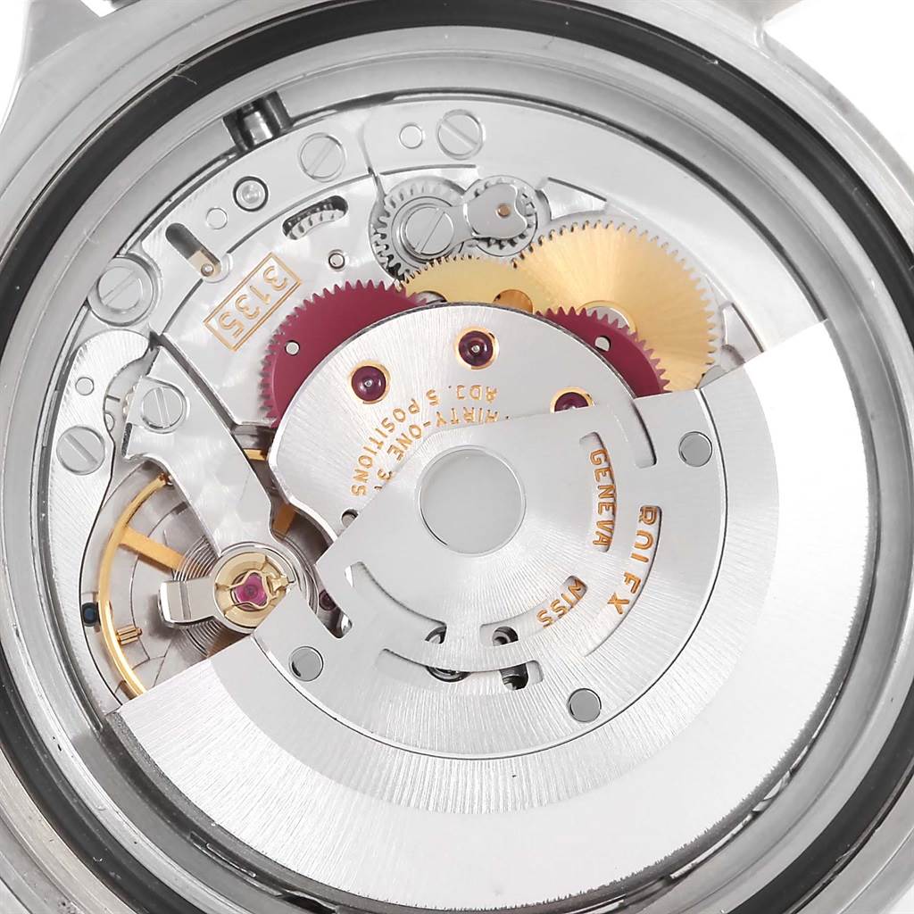 This image shows a close-up of the internal mechanical movement of the Rolex Submariner 16610LV Men
s Stainless Steel Black Dial 16610LV Men
s Stainless Steel Black Dial watch.