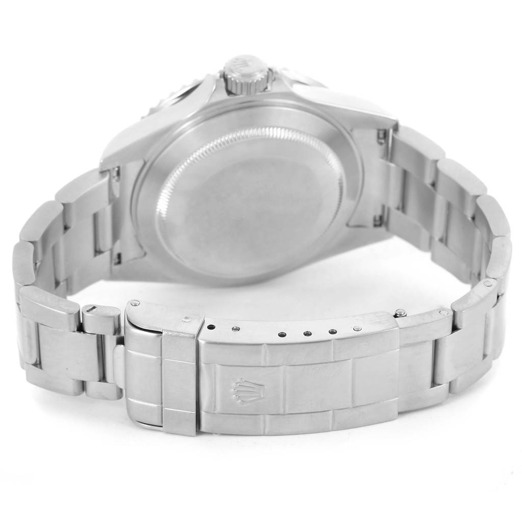 This image shows the back case and stainless steel bracelet of a Rolex Submariner 16610LV Men
s Stainless Steel Black Dial 16610LV Men
s Stainless Steel Black Dial watch, including the deployment clasp.