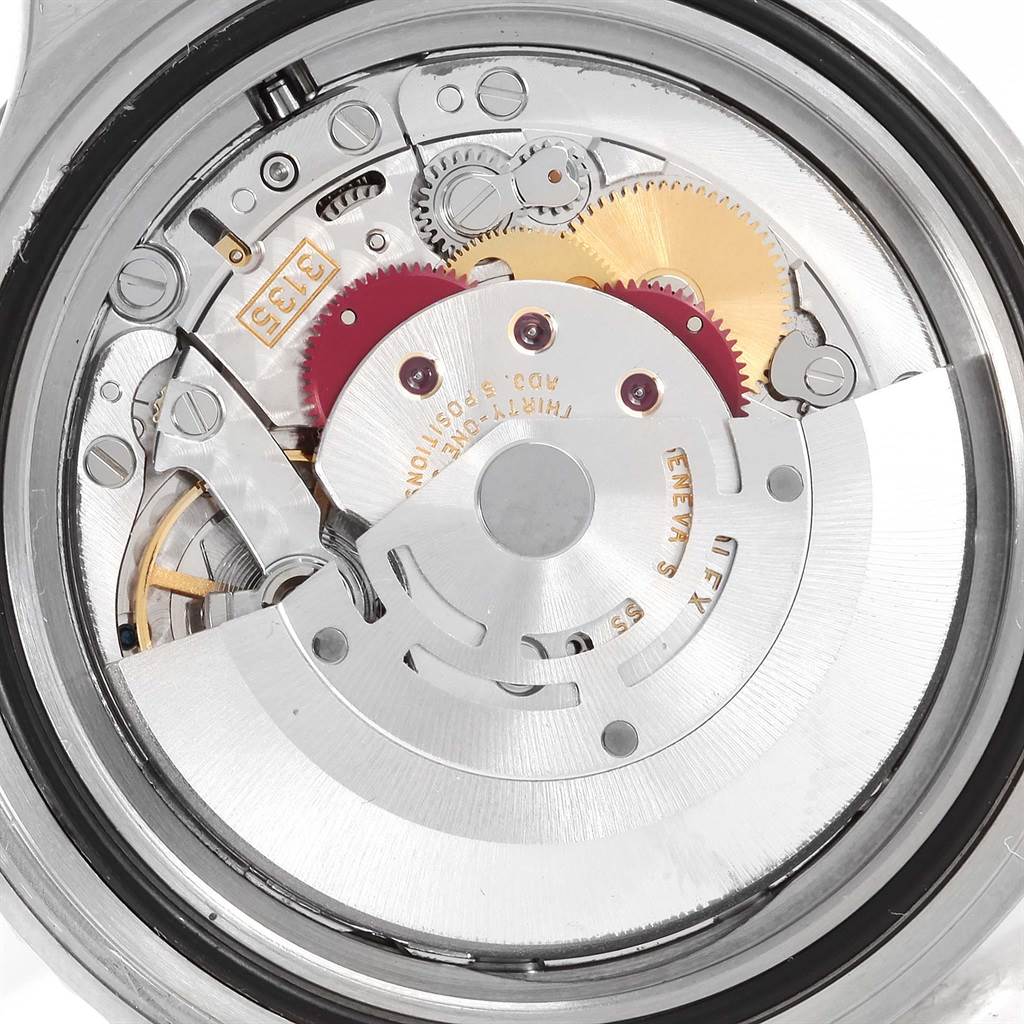 This image shows a close-up of the movement mechanism of a Rolex Submariner 16610 Men
s Stainless Steel Black Dial 16610 Men
s Stainless Steel Black Dial watch.