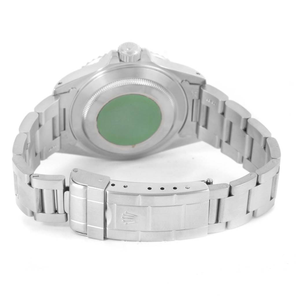 The image shows the back side of a Rolex Submariner 14060 Men
s Stainless Steel Black Dial 14060 Men
s Stainless Steel Black Dial watch, focusing on the case back and bracelet clasp.