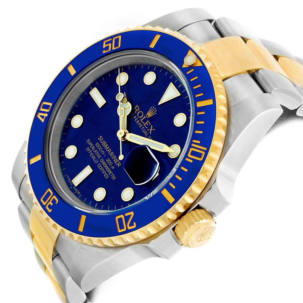 This Rolex Submariner 116613 Men
s Steel and Gold (two tone) Blue Dial 116613 Men
s Steel and Gold (two tone) Blue Dial model is shown at an angled view, featuring its blue dial, bezel, crown, and two-tone bracelet.