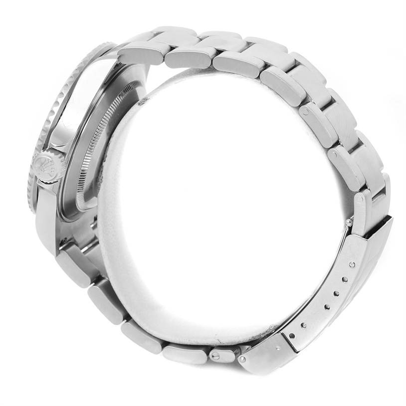 The image shows a side view of a Rolex Submariner 16610 Men
s Stainless Steel Black Dial 16610 Men
s Stainless Steel Black Dial, highlighting its bracelet, clasp, and case.