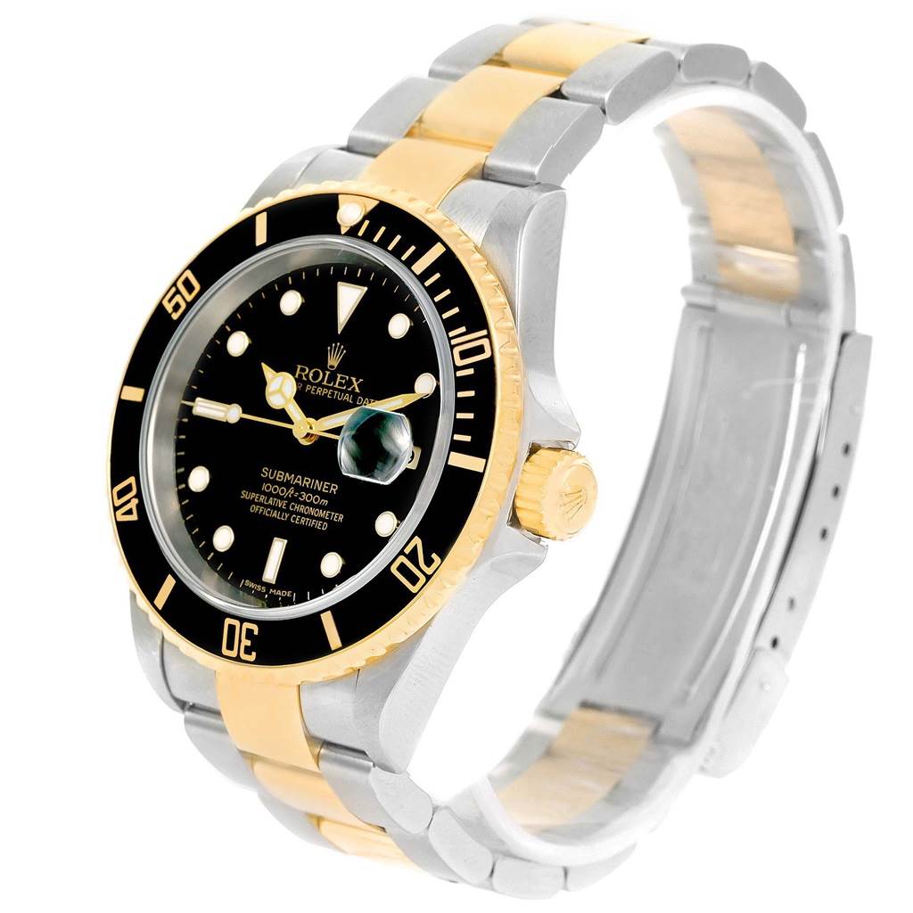 The image shows a Rolex Submariner 16613 Men's Steel and Gold (two tone) Black Dial 16613 Men's Steel and Gold (two tone) Black Dial watch with a black dial, gold bezel, and dual-tone gold and silver bracelet at a three-quarter angle.