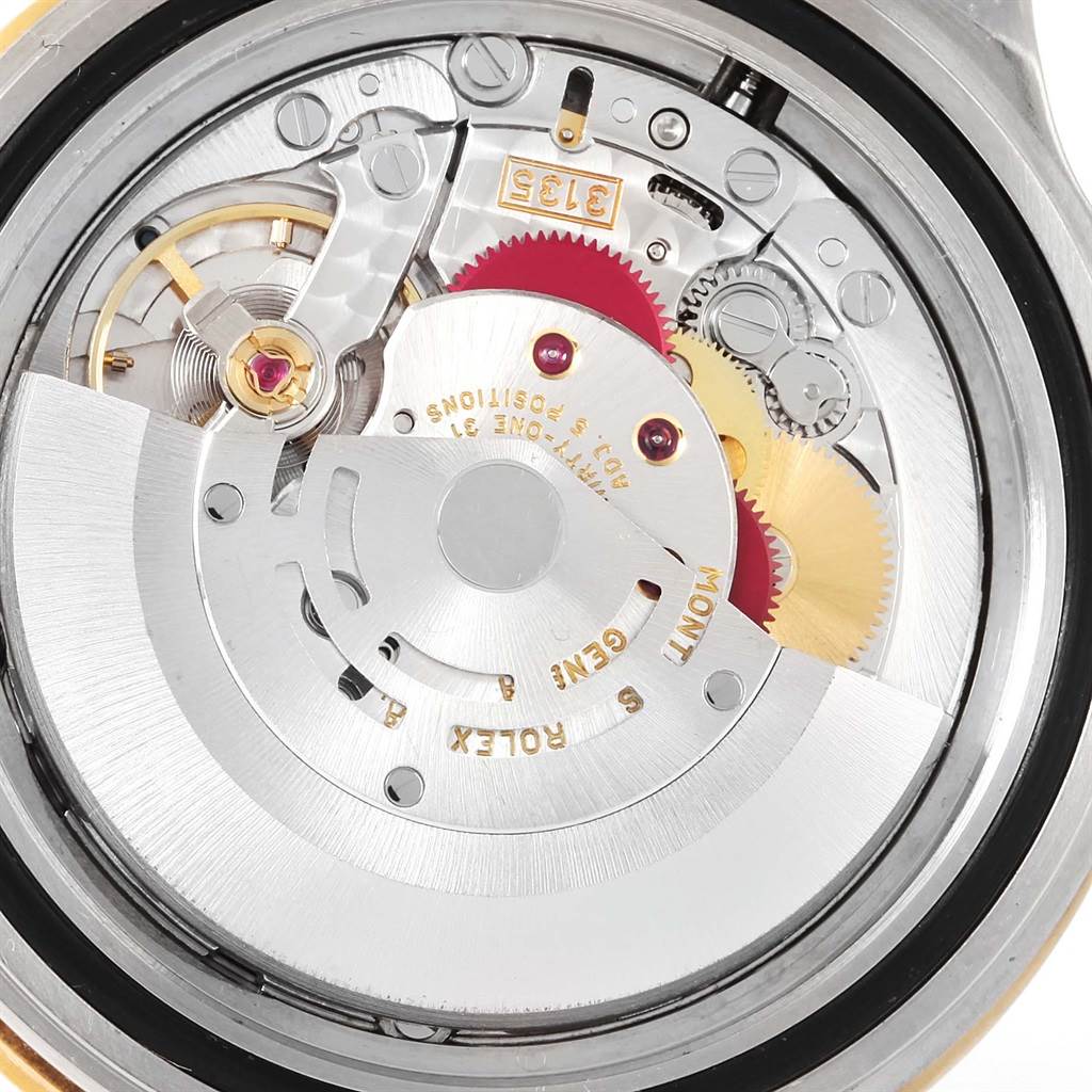 The image shows a close-up of the Rolex Submariner 16613 Men's Steel and Gold (two tone) Black Dial 16613 Men's Steel and Gold (two tone) Black Dial's movement mechanism from the back angle.