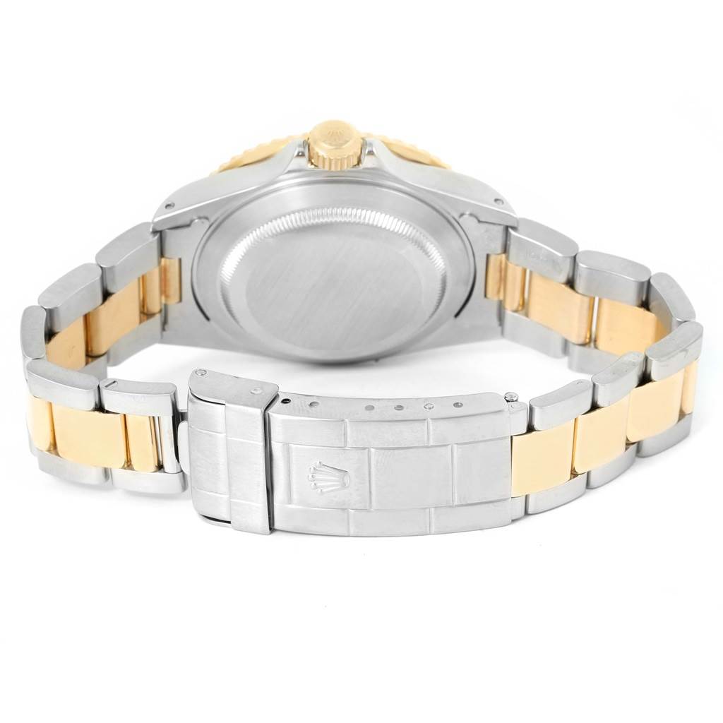 This image shows the Rolex Submariner 16613 Men's Steel and Gold (two tone) Black Dial 16613 Men's Steel and Gold (two tone) Black Dial watch's back case and bracelet from a rear angle.