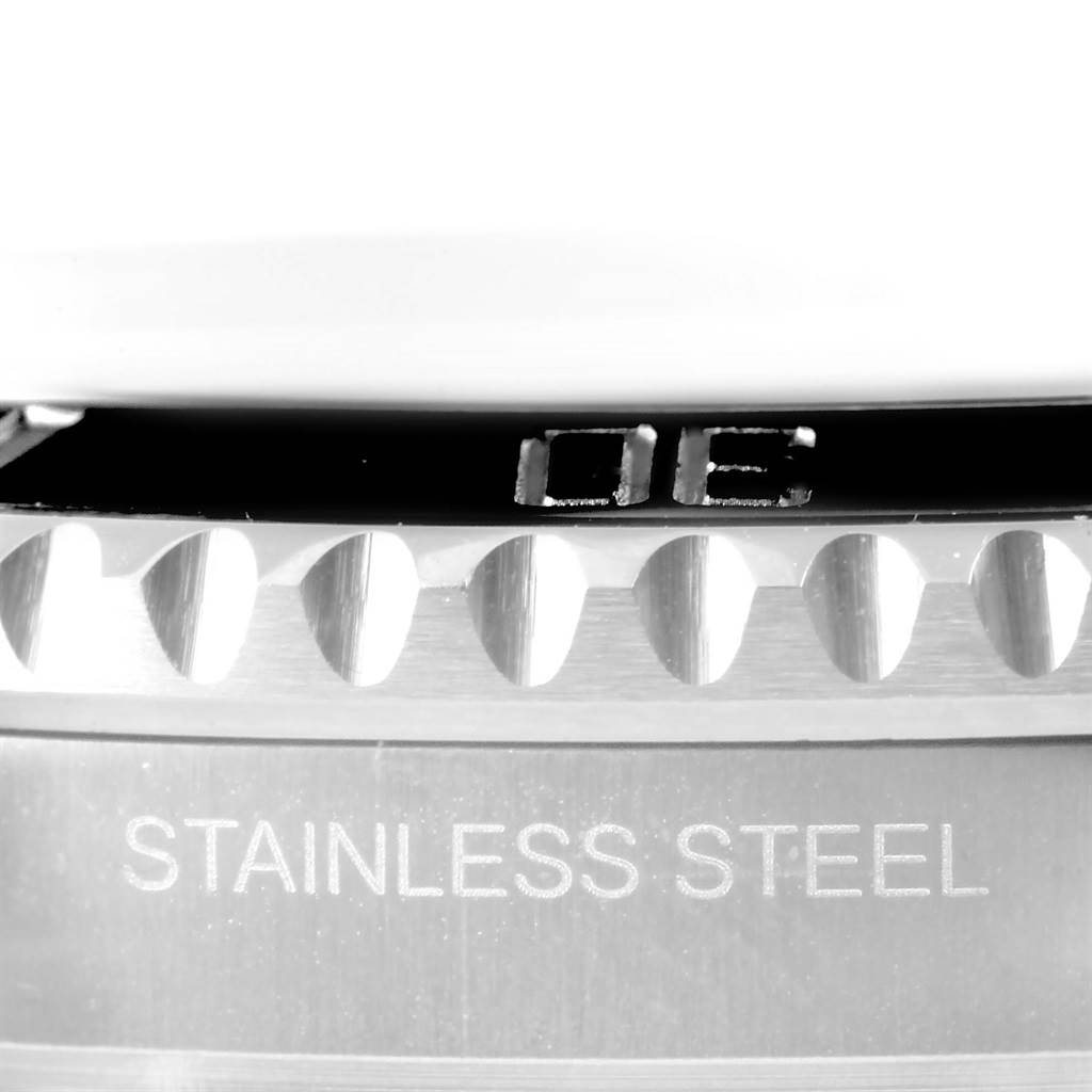 This close-up image shows the bezel and part of the case body with "STAINLESS STEEL" engraving of a Rolex Submariner 114060 Men
s Stainless Steel Black Dial 114060 Men
s Stainless Steel Black Dial watch.